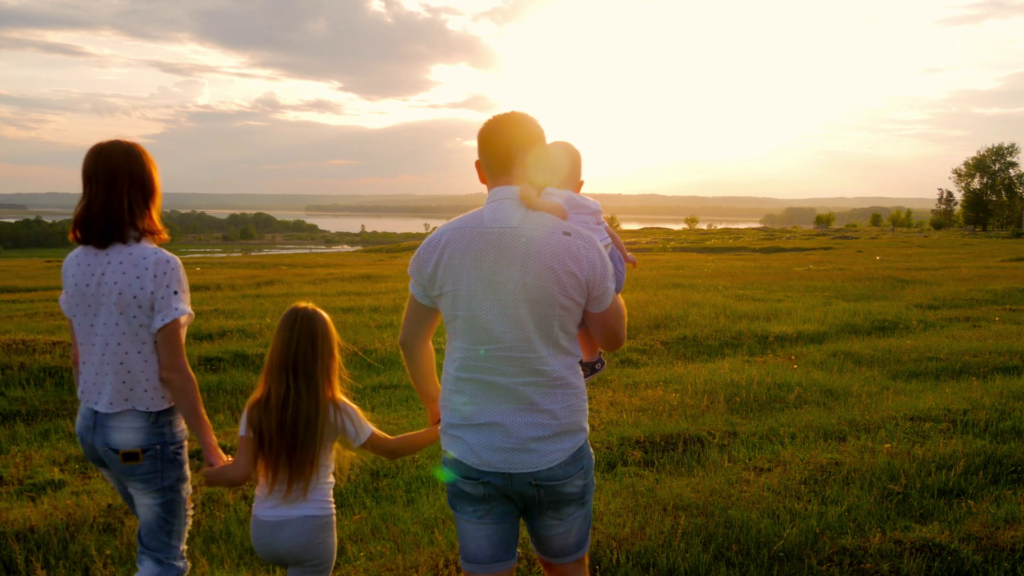 videoblocks-happy-young-family-with-two-children-running-on-summer-field-healthy-mother-father-and-little-children-enjoying-nature-together-outdoors-at-sunset_bfk7zgbyx_thumbnail-1080_0